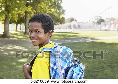 Mixed race boy smiling outdoors View Large Photo Image Stock Photo - Mixed race boy smiling outdoors. Fotosearch