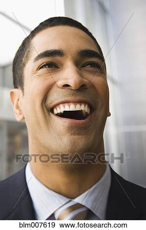 Mixed race businessman laughing View Large Photo Image Stock Photo - Mixed race businessman laughing. Fotosearch