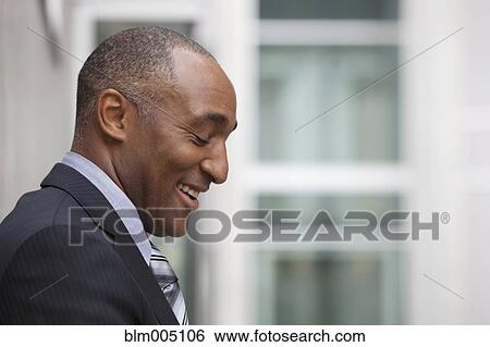 Mixed race businessman laughing View Large Photo Image Stock Photograph - Mixed race businessman laughing. Fotosearch