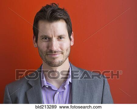 Stock Photo - Mixed race businessman smiling. Fotosearch
