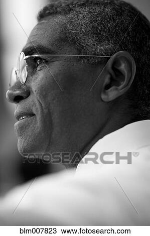 Stock Image - Mixed race businessman with eyeglasses. Fotosearch