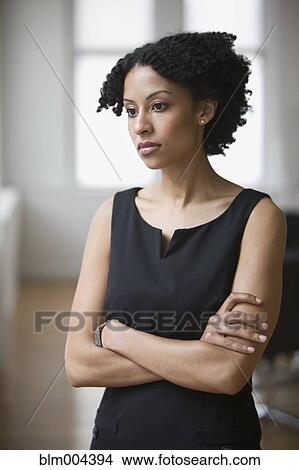 Picture - Mixed race businesswoman looking disappointed. Fotosearch