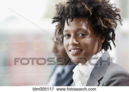 Stock Photo - Mixed race businesswoman smiling. Fotosearch