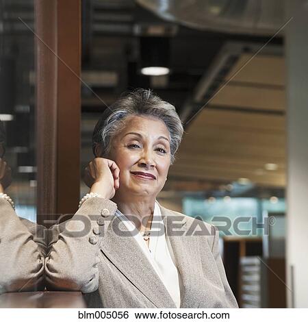 Stock Photograph - Mixed race businesswoman smiling. Fotosearch