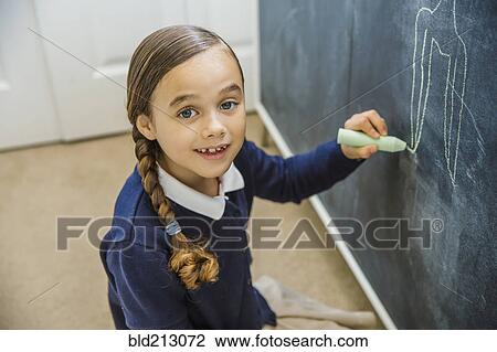 Mixed race girl drawing on chalkboard View Large Photo Image Stock Image - Mixed race girl drawing on chalkboard. Fotosearch