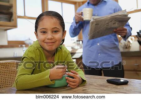 Mixed race girl eating cereal View Large Photo Image Picture - Mixed race girl eating cereal. Fotosearch