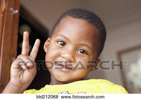 Mixed race girl giving peace sign View Large Photo Image Stock Photo - Mixed race girl giving peace sign. Fotosearch