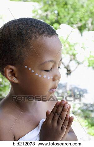 Mixed race girl praying View Large Photo Image Stock Image - Mixed race girl praying. Fotosearch