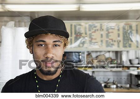 Mixed race man in diner View Large Photo Image Stock Photo - Mixed race man in diner. Fotosearch