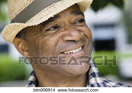 Mixed race man in hat View Large Photo Image Picture - Mixed race man in hat. Fotosearch