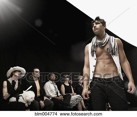 Picture - Mixed race model on runway in fashion show. Fotosearch