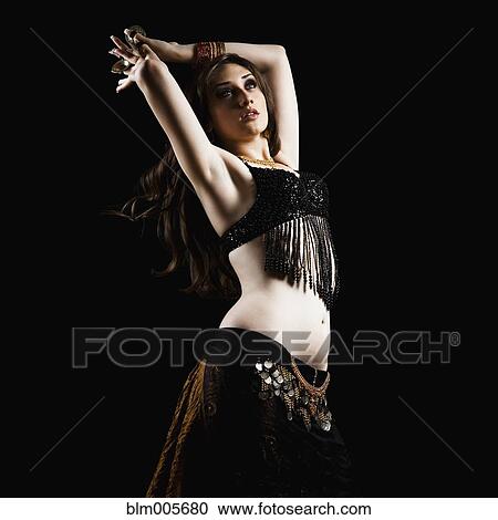 Mixed race woman belly dancing View Large Photo Image Stock Image - Mixed race woman belly dancing. Fotosearch