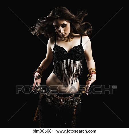 Mixed race woman belly dancing View Large Photo Image Stock Image - Mixed race woman belly dancing. Fotosearch