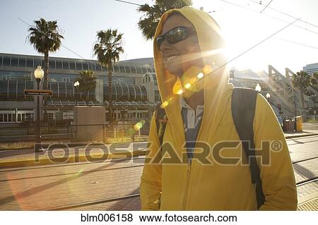 Mixed race woman in hoody and sunglasses walking View Large Photo Image Stock Photo - Mixed race woman in hoody and sunglasses walking. Fotosearch