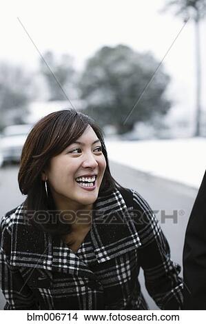 Mixed race woman laughing outdoors View Large Photo Image Picture - Mixed race woman laughing outdoors. Fotosearch