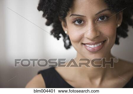 Mixed race woman smiling View Large Photo Image Stock Image - Mixed race woman smiling. Fotosearch