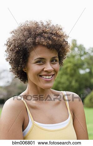 Mixed race woman smiling View Large Photo Image Stock Image - Mixed race woman smiling. Fotosearch
