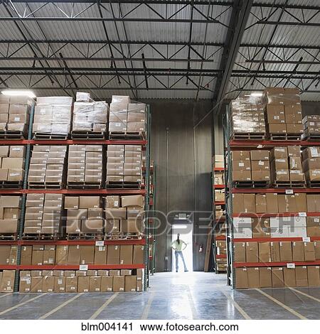 Mixed race woman standing at doorway of warehouse View Large Photo Image Stock Image - Mixed race woman standing at doorway of warehouse. Fotosearch