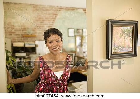 Mixed race woman standing in doorway View Large Photo Image Picture - Mixed race woman standing in doorway. Fotosearch