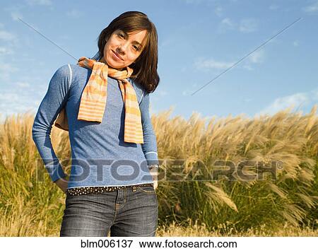 Stock Photo - Mixed race woman standing outdoors. Fotosearch