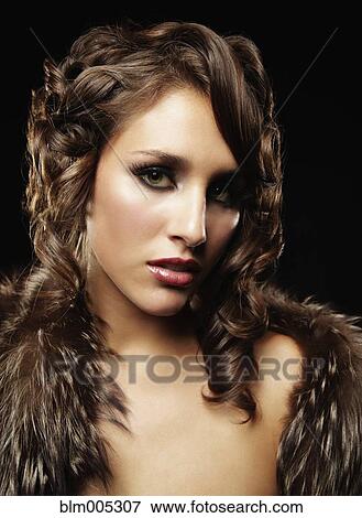Stock Photo - Mixed race woman wearing furs. Fotosearch