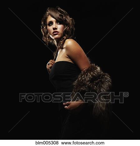 Stock Photo - Mixed race woman wearing furs. Fotosearch