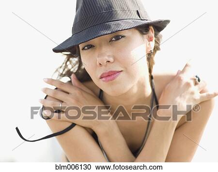 Mixed race woman wearing hat View Large Photo Image Stock Image - Mixed race woman wearing hat. Fotosearch