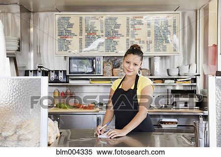 Mixed race woman working at diner View Large Photo Image Stock Photography - Mixed race woman working at diner. Fotosearch