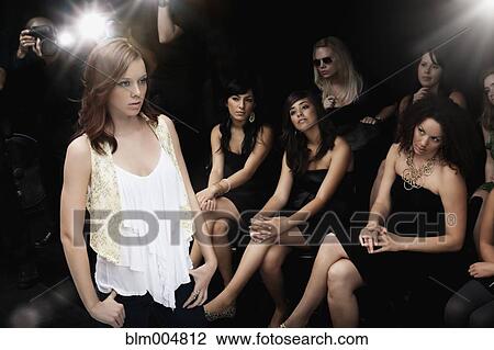 Stock Image - Model on runway in fashion show. Fotosearch