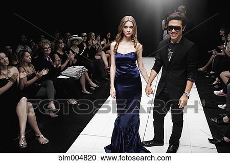 Stock Image - Models on runway in fashion show. Fotosearch