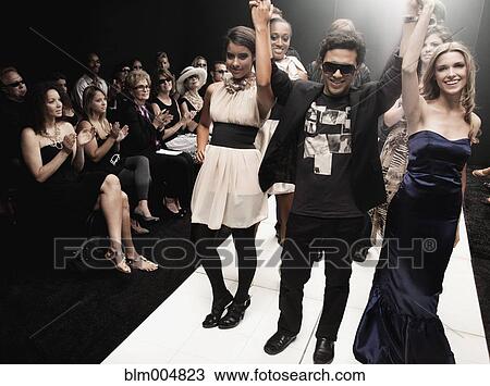 Stock Image - Models on runway in fashion show. Fotosearch