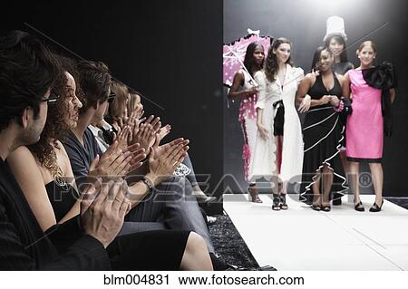 Stock Image - Models on runway in fashion show. Fotosearch