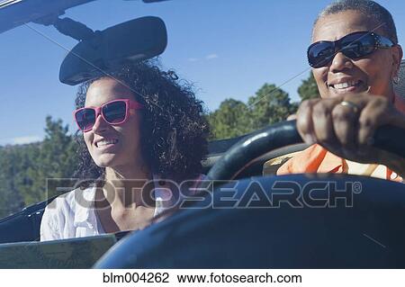 Mother and daughter in convertible View Large Photo Image Stock Image - Mother and daughter in convertible. Fotosearch