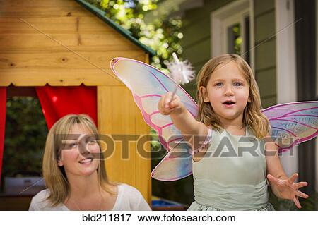 Stock Photo - Mother and daughter in playhouse. Fotosearch
