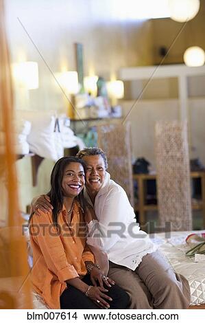 Picture - Mother and daughter shopping together. Fotosearch