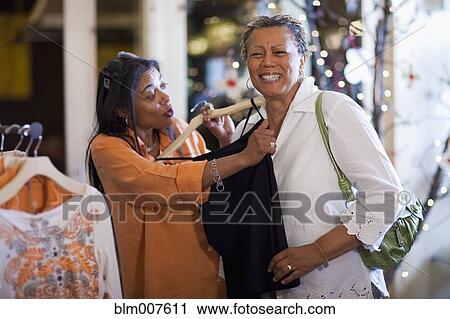 Stock Image - Mother and daughter shopping together. Fotosearch