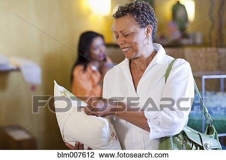 Stock Image - Mother and daughter shopping together. Fotosearch