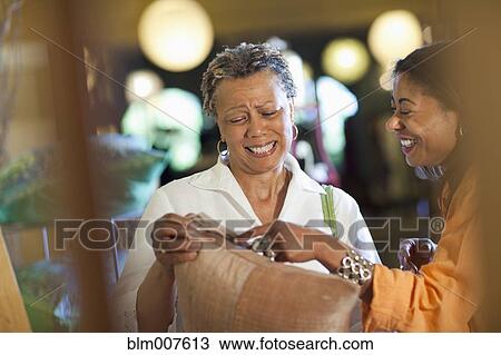 Stock Image - Mother and daughter shopping together. Fotosearch