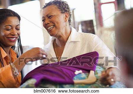 Mother and daughter shopping together View Large Photo Image Stock Photograph - Mother and daughter shopping together. Fotosearch