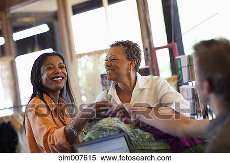 Stock Photography - Mother and daughter shopping together. Fotosearch