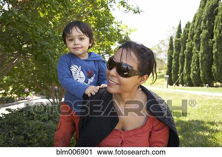 Mother and son enjoying park View Large Photo Image Stock Image - Mother and son enjoying park. Fotosearch