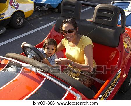 Mother and son in bumper car View Large Photo Image Stock Photograph - Mother and son in bumper car. Fotosearch