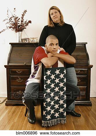 Stock Photograph - Mother and son posing with American flag blanket. Fotosearch