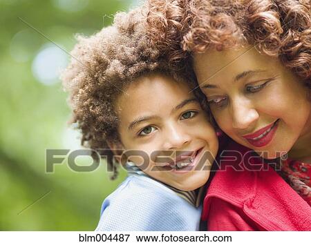 Stock Photo - Mother and son smiling. Fotosearch