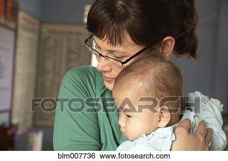 Mother hugging baby View Large Photo Image Stock Photograph - Mother hugging baby. Fotosearch