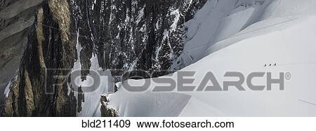 Stock Photo - Mountaineers heading to Mt. Blanc, Chamonix, France. Fotosearch