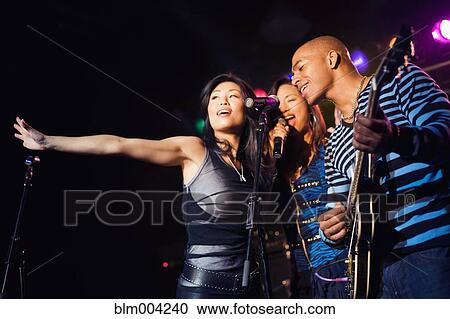 Musical group performing onstage View Large Photo Image Stock Image - Musical group performing onstage. Fotosearch