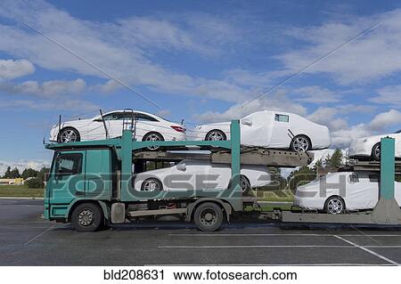 New cars on truck View Large Photo Image Stock Image - New cars on truck. Fotosearch