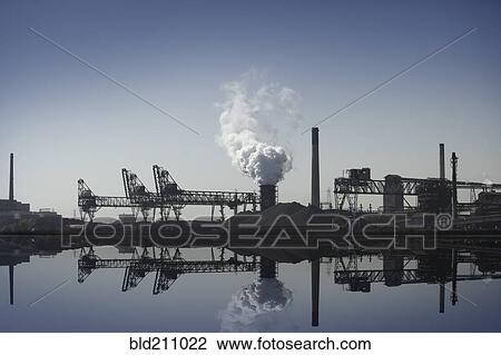 Stock Image - Nuclear power plant reflected in still lake, Detroit, Michigan, United States. Fotosearch