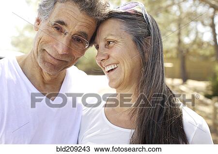 Stock Image - Older Caucasian couple smiling. Fotosearch